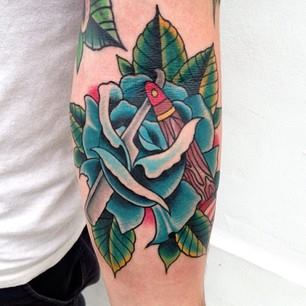 Traditional Rose With Razor Tattoo On Left Forearm By Sam Ricketts