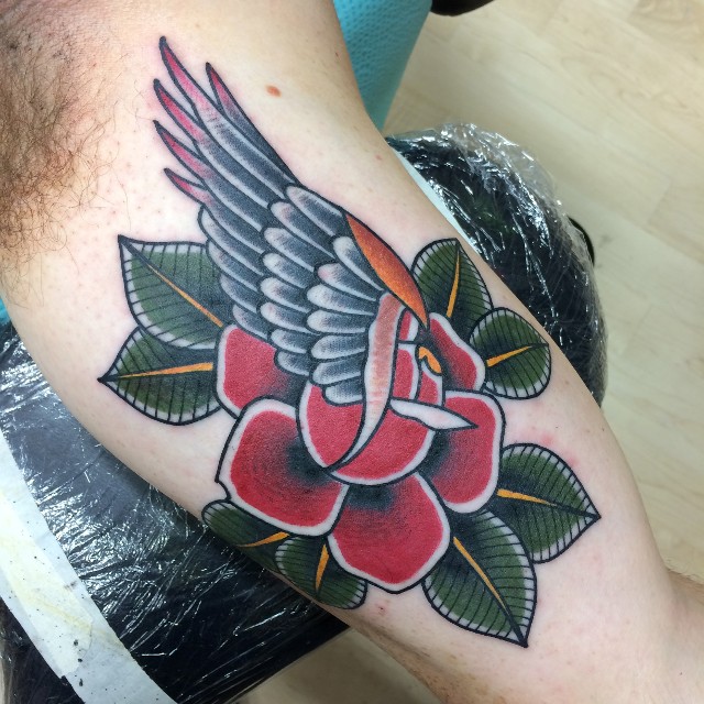 Traditional Rose With Wing Tattoo On Bicep