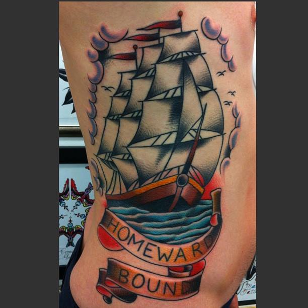 Traditional Ship With Banner Tattoo On Man Right Side Rib By Chris Martin