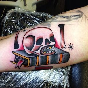 Traditional Skull On Book Tattoo On Right Half Sleeve By Sam Ricketts
