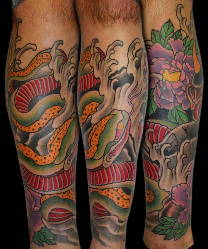 Traditional Snake With Flowers Tattoo On Leg Calf