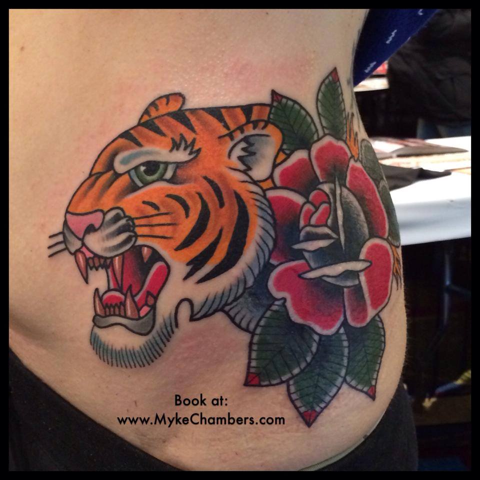 Traditional Tiger Head With Rose Tattoo On Left Side Rib By Myke Chambers