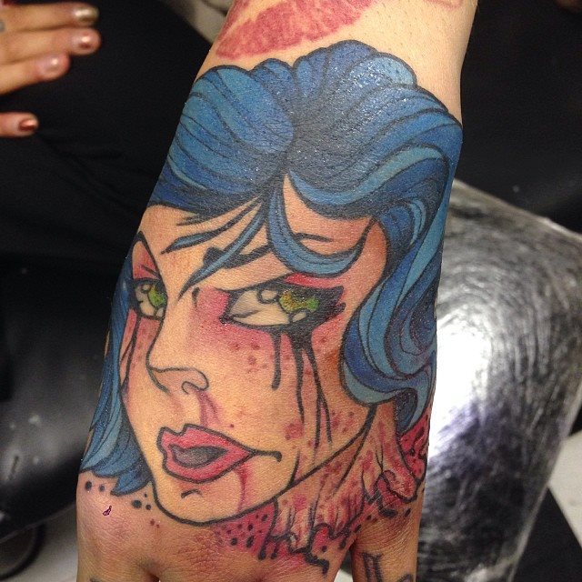 Traditional Women Face Tattoo On Left Hand By Scott Owen