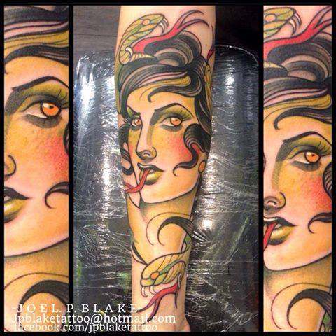 Traditional Women Head With Snake Tattoo On Forearm By Joel P Blake