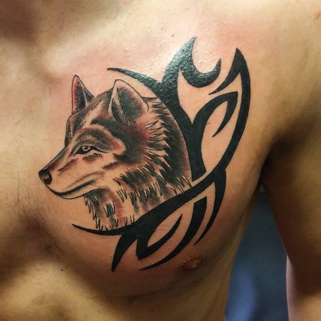 Tribal And Wolf Head Tattoo On Chest For Men