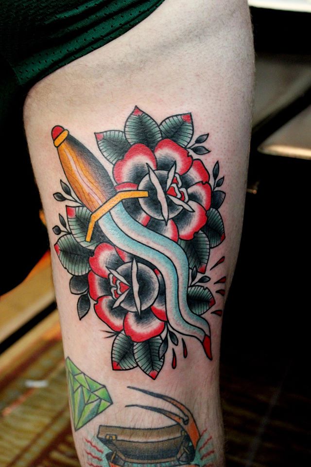 Unique Dagger With Roses Tattoo On Half Sleeve.