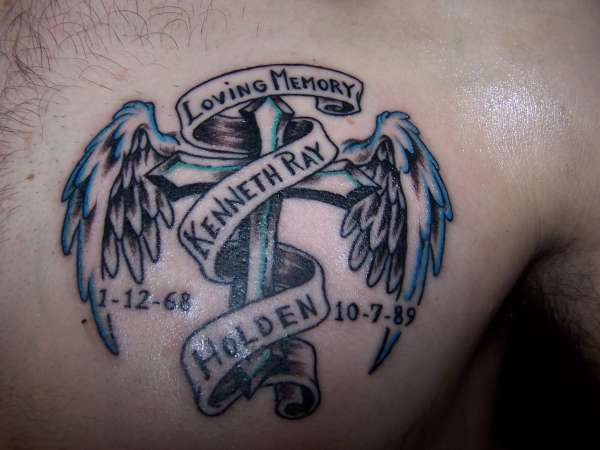 Winged Cross In Loving Memory Memorial Tattoo On Man Chest