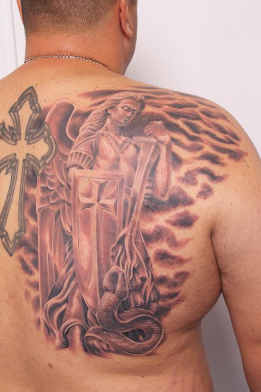 Wonderful Black Ink Archangel Michael Tattoo On Man Right Back Shoulder