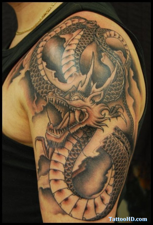 Wonderful Black Ink Dragon Tattoo On Man Left Half Sleeve