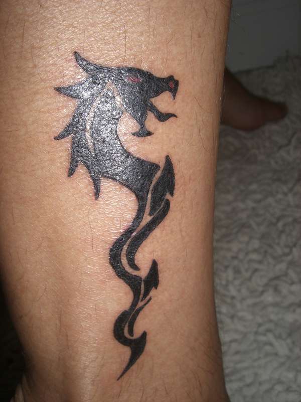 Wonderful Black Tribal Dragon Tattoo Design For Leg