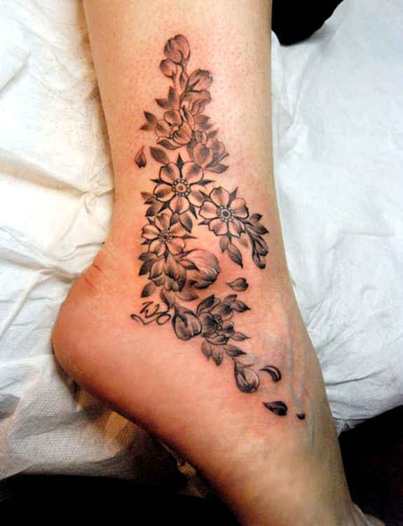 Amazing Black Ink Flowers Tattoo On Right Ankle