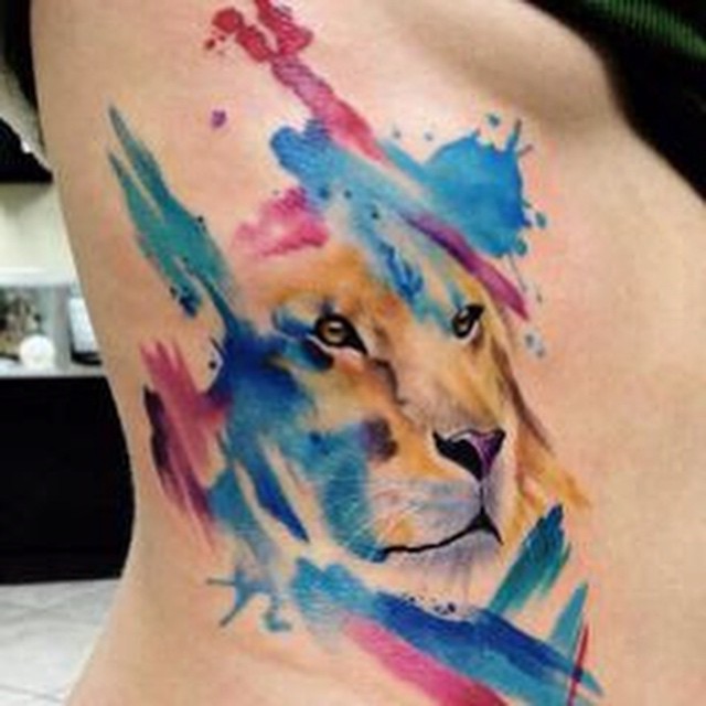 Aqua Lion Head Tattoo On Right Side Rib