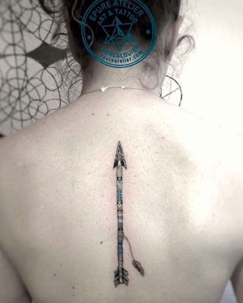 Attractive Arrow Tattoo On Upper Back By Marie Roura