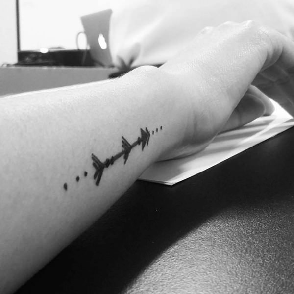 Attractive Black Ink Arrow Tattoo On Right Side Wrist