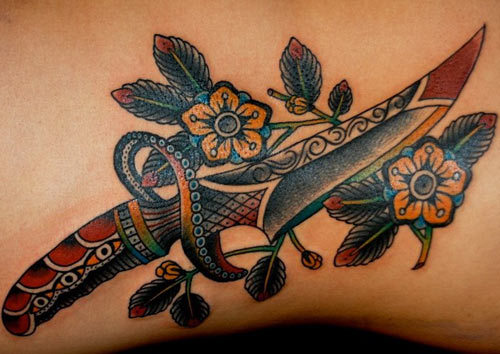 Attractive Dagger With Flowers Tattoo Design