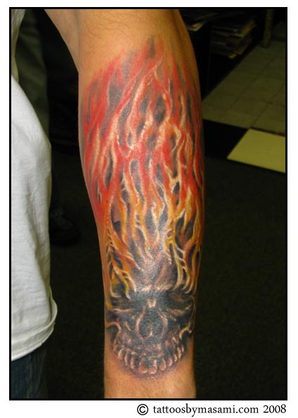 Attractive Skull In Fire And Flame Tattoo On Left Arm
