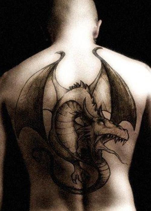 Awesome Black Ink Dragon Tattoo On Man Full Back