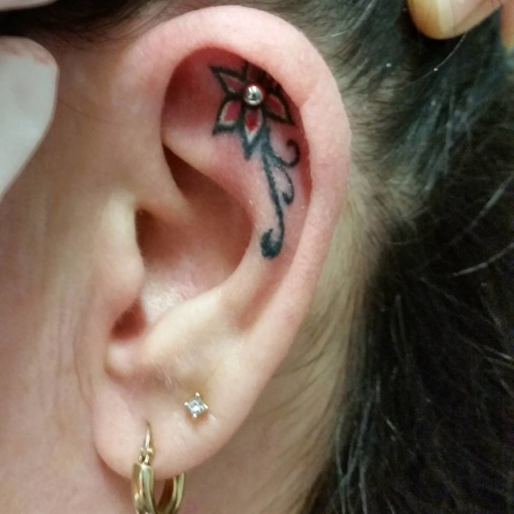 Awesome Flower Tattoo On Women Left Ear