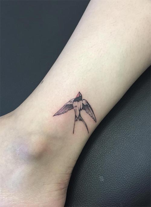 Awesome Flying Bird Tattoo On Right Ankle