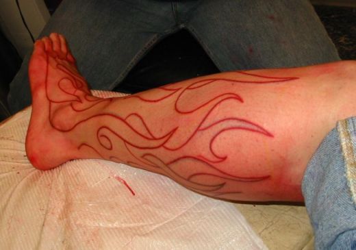 Awesome Outline Fire And Flame Tattoo On Left Leg