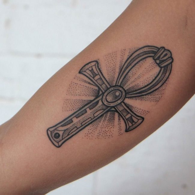 Awesome Black Ink Ankh Tattoo On Forearm