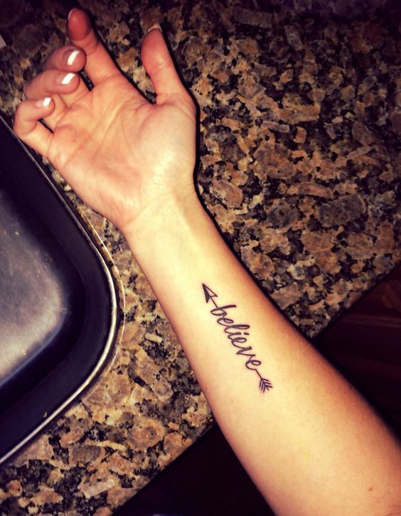 Believe – Black Ink Arrow Tattoo On Right Forearm