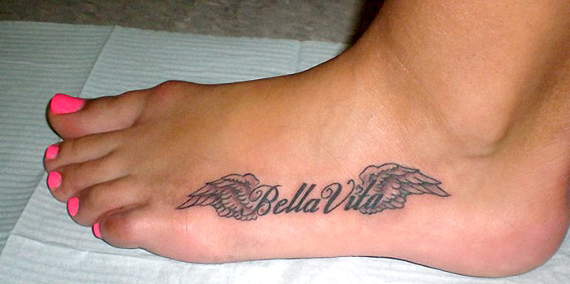 Bella Vita - Black Ink Wings Tattoo On Women Left Foot
