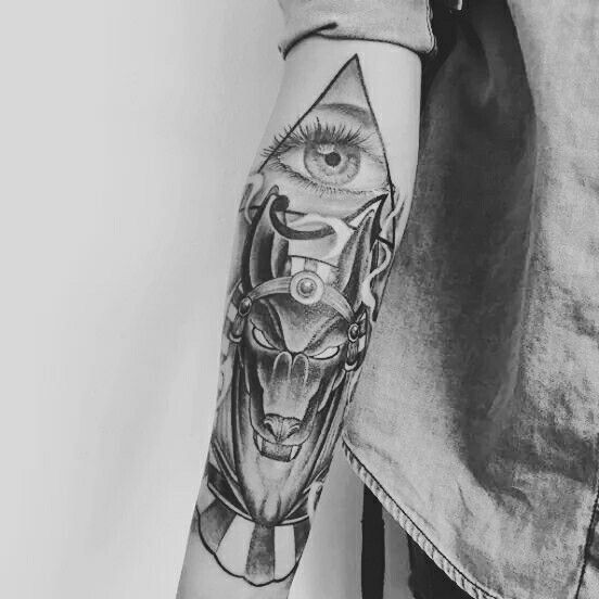 Black And Grey Anubis With Illuminati Eye Tattoo On Right Forearm