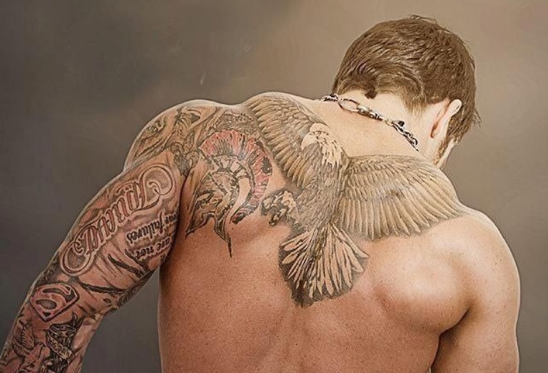 Black And Grey Eagle Tattoo On Man Upper Back