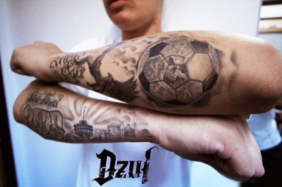Black And Grey Football Tattoo On Man Left Arm