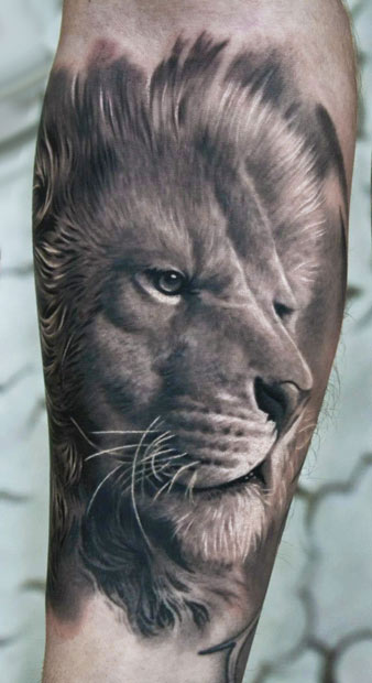 Black And Grey Lion Head Tattoo On Sleeve