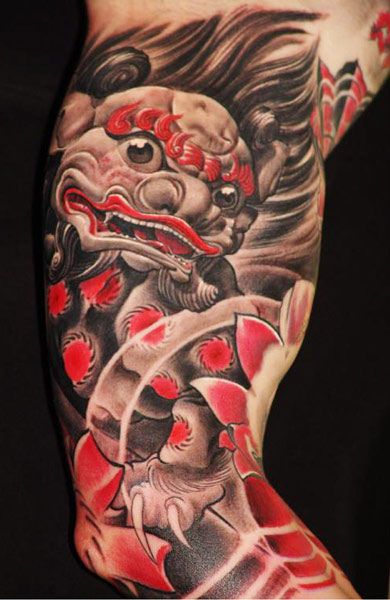 Black And Red Foo Dog Tattoo On Right Half Sleeve