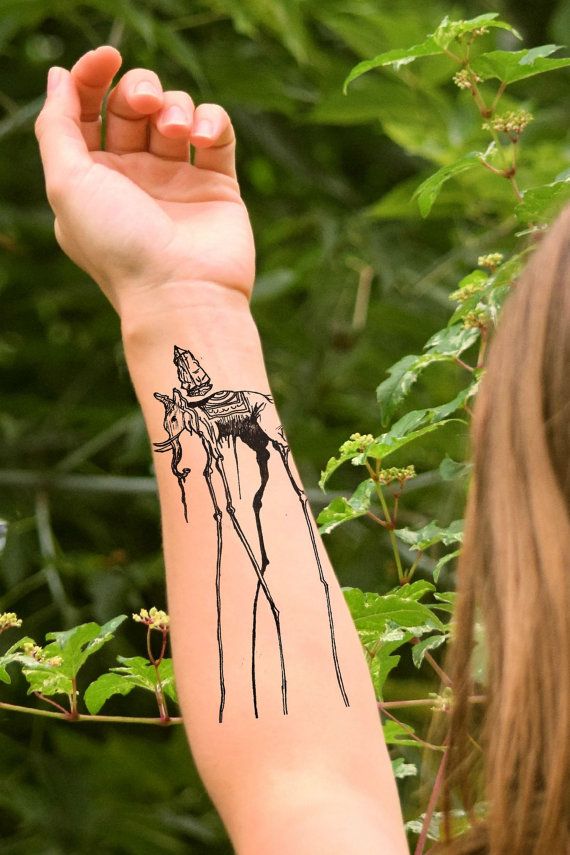 Black Dali Elephant Tattoo On Women Left Forearm