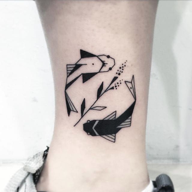 Black Geometric Two Fishes Tattoo On Leg