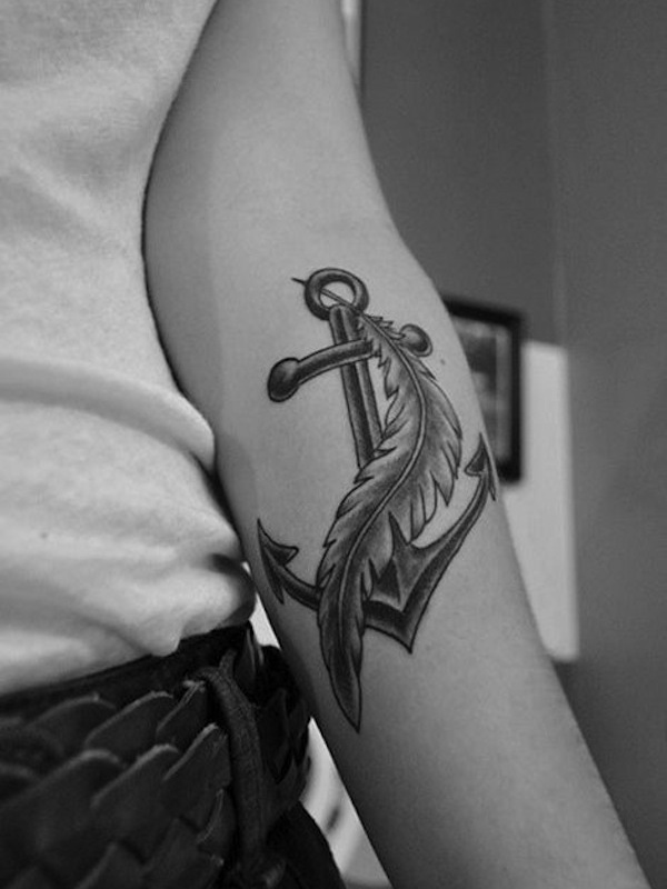 Black Ink Anchor With Feather Tattoo On Left Forearm