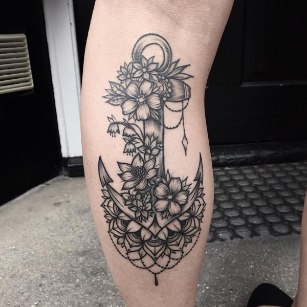 Black Ink Anchor With Flowers Tattoo On Left Leg Calf