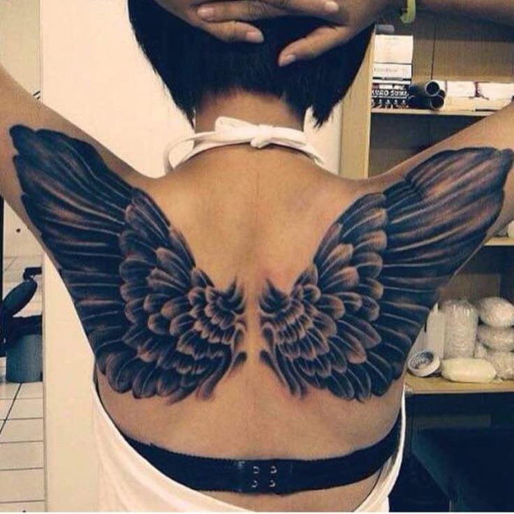 Black Ink Angel Wings Tattoo On Upper Back