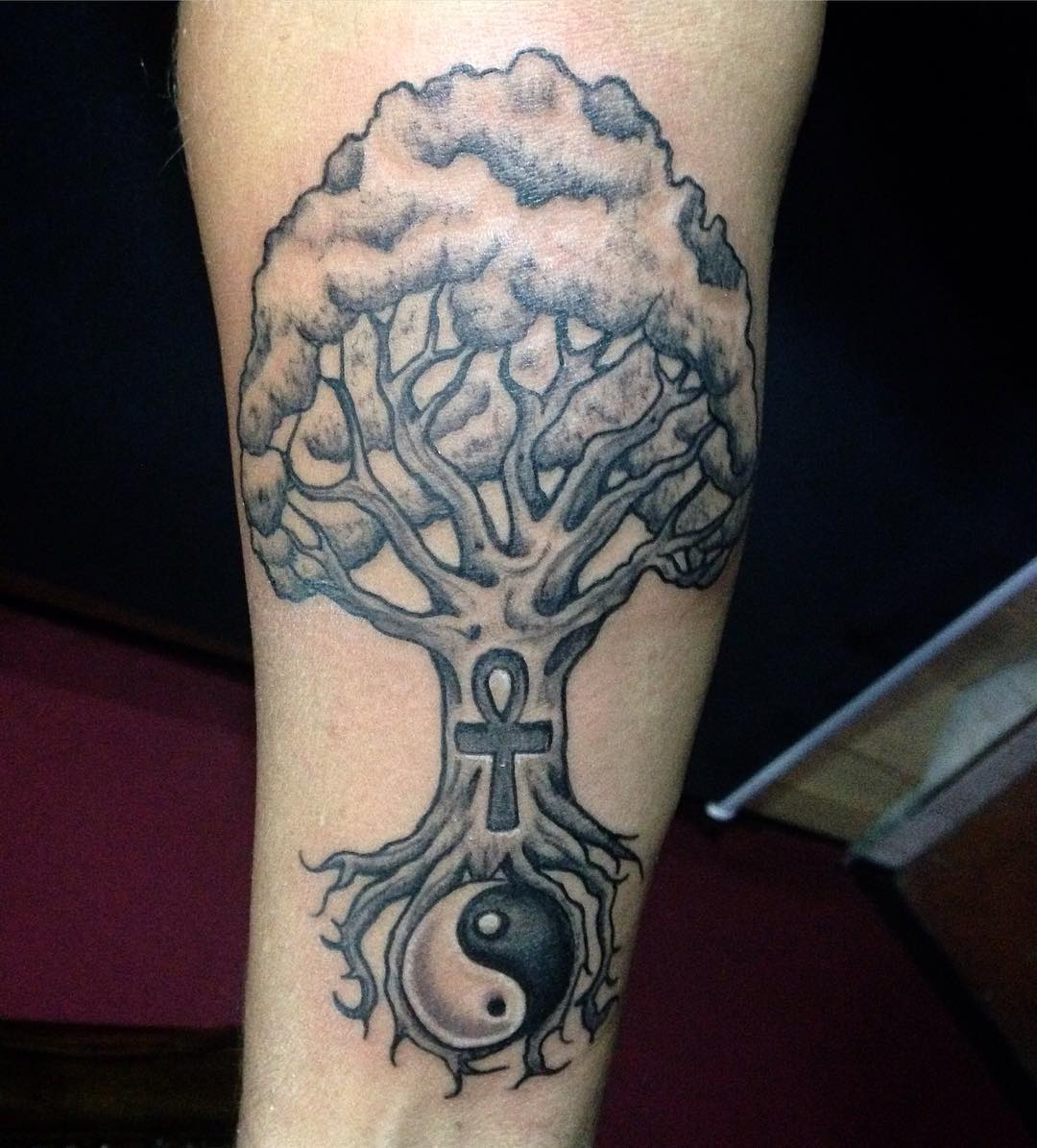 Black Ink Ankh With Tree And Yin Yang Tattoo On Forearm