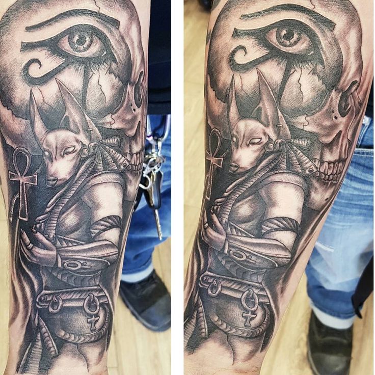 Black Ink Anubis With Eye Of Horus Tattoo On Right Half Sleeve