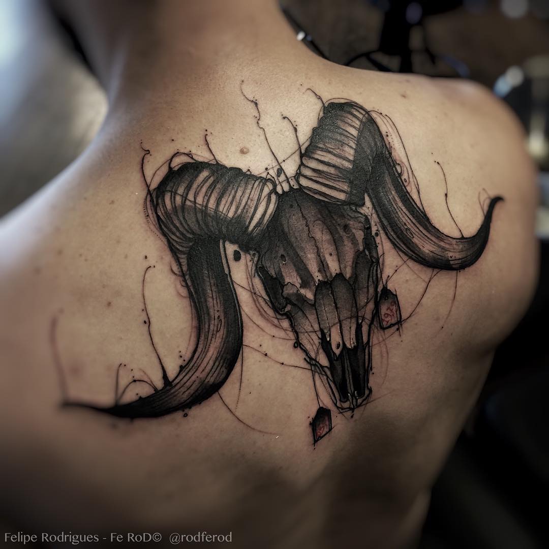 Black Ink Aries Skull Tattoo On Man Upper Back