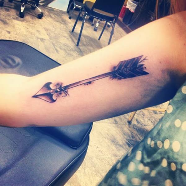 Black Ink Arrow Tattoo On Bicep