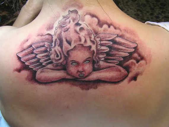 Black Ink Baby Angel Tattoo On Upper Back