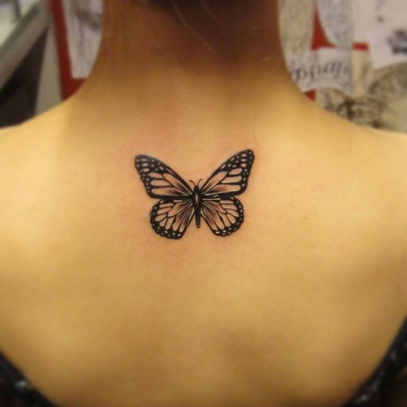 Black Ink Butterfly Tattoo On Women Upper Back