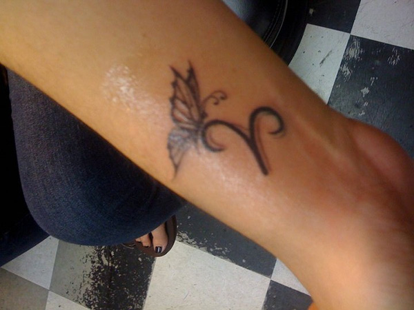 Black Ink Butterfly With Aries Symbol Tattoo On Right Forearm
