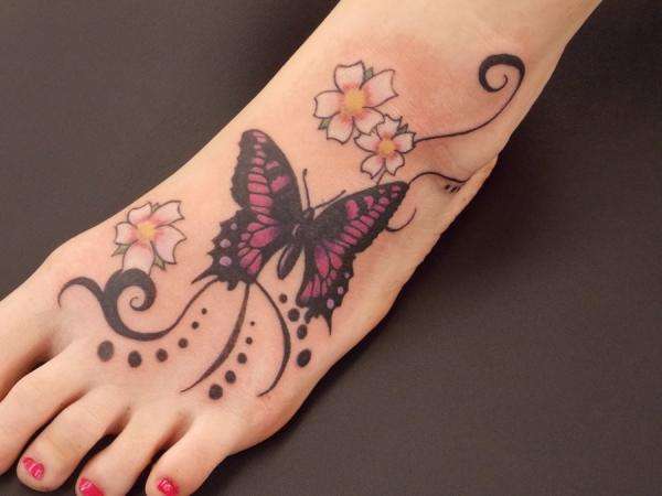 Black Ink Butterfly With Flowers Tattoo On Girl Left Foot
