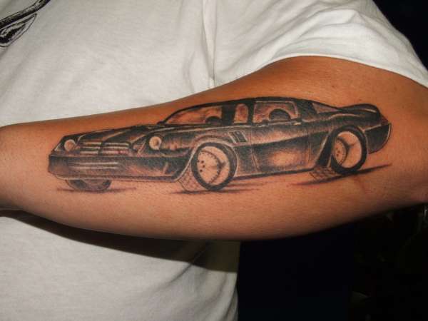 Black Ink Camaro Car Tattoo On Left Arm