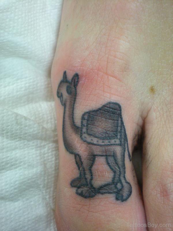 Black Ink Camel Tattoo On Right Toe