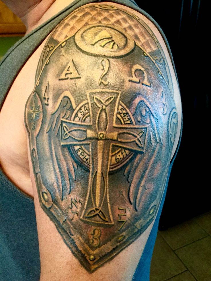 Black Ink Cross Armor Tattoo On Left Shoulder