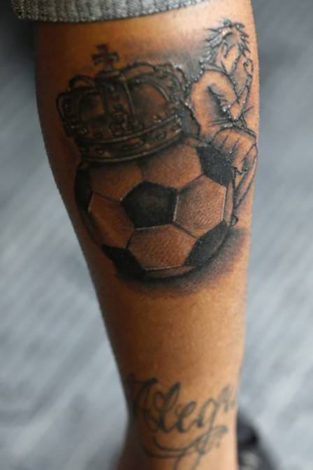 Black Ink Crown On Football Tattoo On Leg Calf