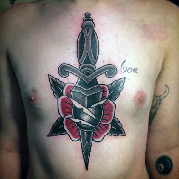 Black Ink Dagger In Rose Tattoo On Man Chest
